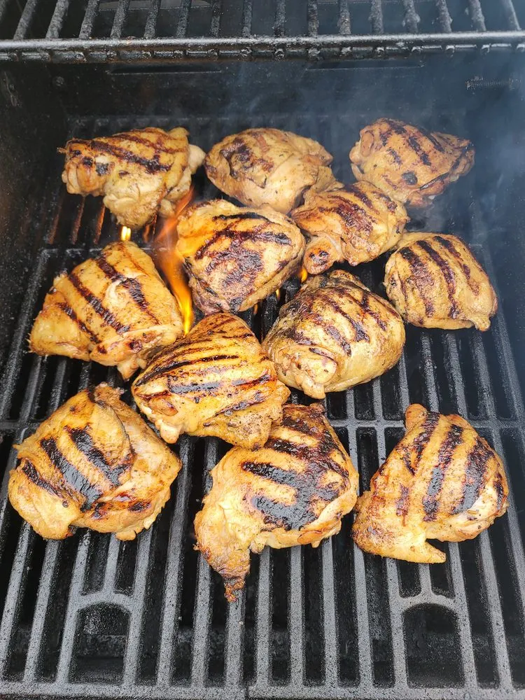 Grilled chicken thighs on the grill
